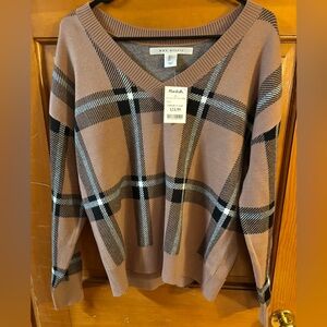 Women’s v- neck sweater. Brand new with tags. Tan with black and brown pattern